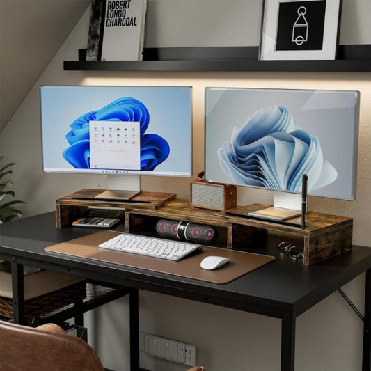Dark wood rotating monitor stand with side storage and monitor risers for desk setup.
