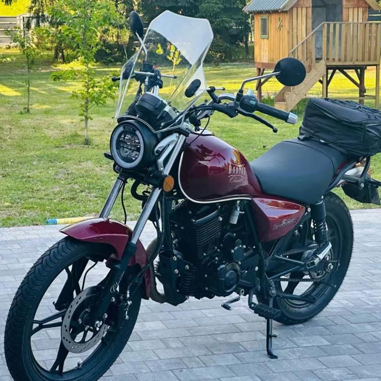 Universal clear motorcycle windshield mounted at the front of the bike