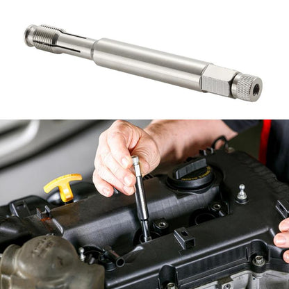 Spark plug thread repair tool with knurled handle and threaded end, held near engine