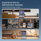 Compact countertop ice maker with illuminated window and control panel.