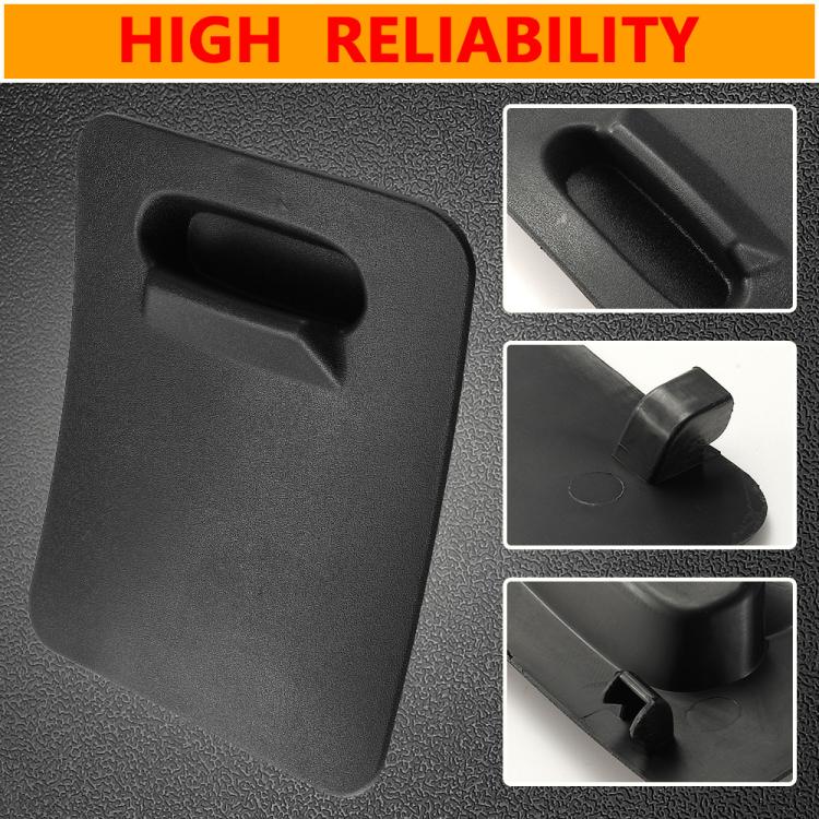 Engine access panel close-up, dark textured surface with recessed handle