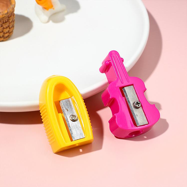 Pink and yellow manual single-hole pencil sharpeners with metal sharpening slots