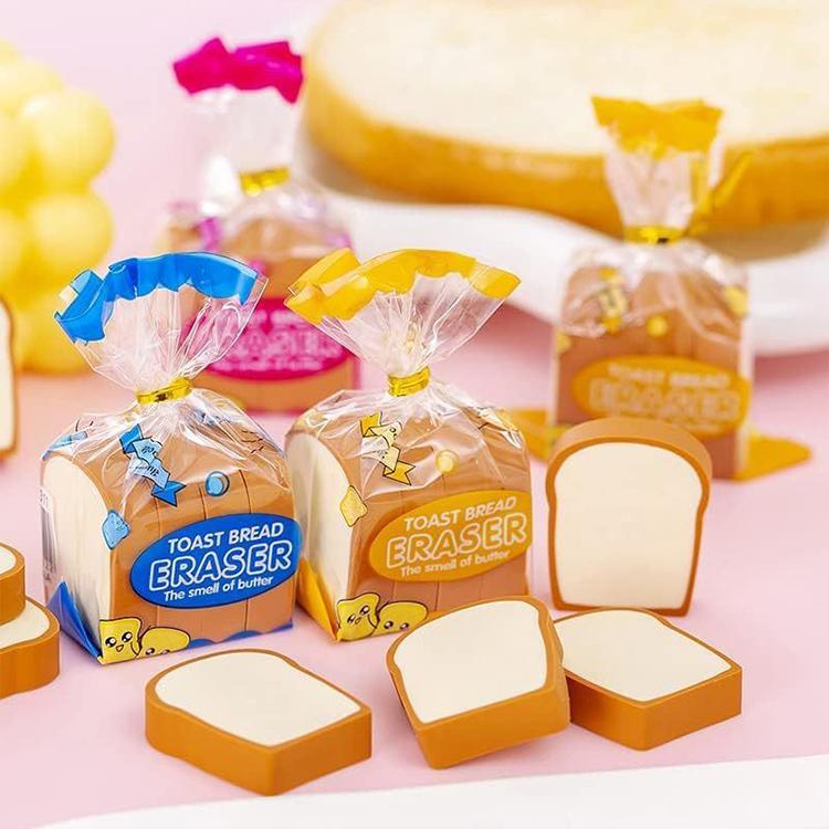 Packaged toast bread eraser pieces with blue, yellow, and orange packs and foam toast slices.