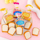 Tray of toast bread eraser packs with several foam slice erasers in orange-brown edges.