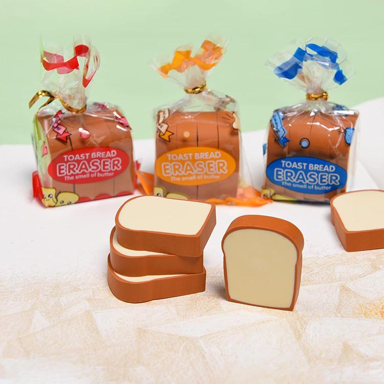 Toast bread eraser set with brown wrapped packs and stacked orange-brown slice erasers.