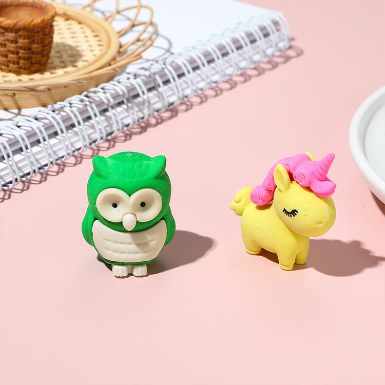 3D animal erasers: green dinosaur and yellow unicorn with pink mane