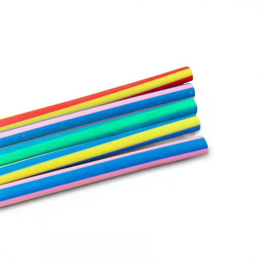 Close-up of multicolor striped pencil bodies with red caps