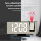 Mirror projection digital clock with red LED digits and projection lens area