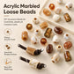 Large-hole acrylic beads, glossy marbled white and amber mix, some threaded on cord