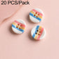 Colorful resin button set: rainbow striped buttons with red and blue two-hole designs.