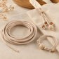 Light beige PU leather beading cord rolls with knotted bracelet and wooden bead accents
