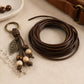 Dark brown PU leather beading cord with leaf charm keychain and wooden bead details