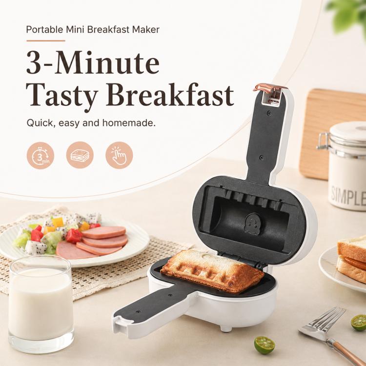 Portable mini breakfast maker with hinged lid open, showing a cooked sandwich