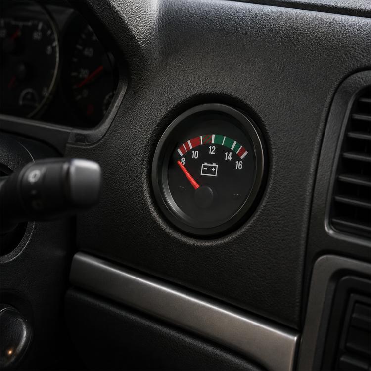 52mm analog pointer voltmeter mounted in a car dash with red needle and black bezel