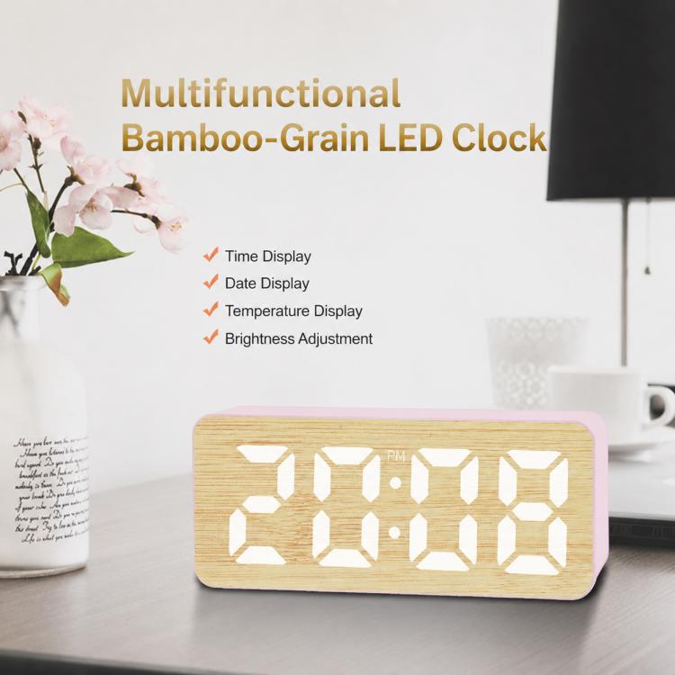 Bamboo-grain LED clock displaying time digits with brightness icon on pink frame.