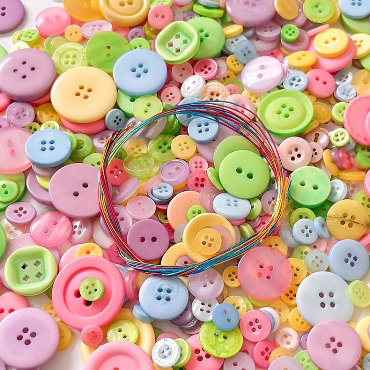Close-up of mixed pastel round resin buttons with a colorful wire bundle