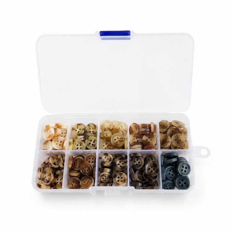Mixed-color four-hole resin button kit with open case holding tan and brown buttons