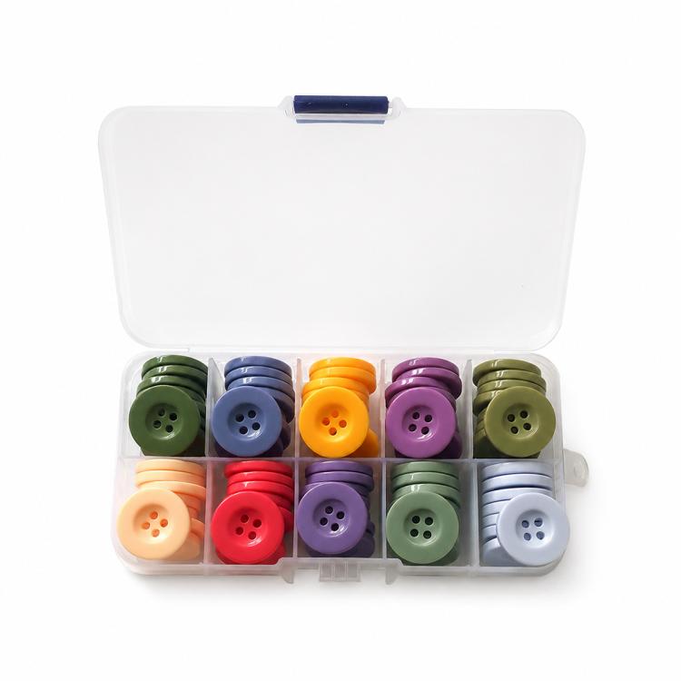 Mixed-color four-hole resin buttons kit in open case with stacked pairs per color