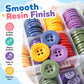 Four-hole resin buttons with glossy smooth finish, assorted colors in compartments