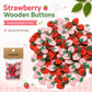 Assorted strawberry wooden buttons, red and pink with green leaves, in a bag