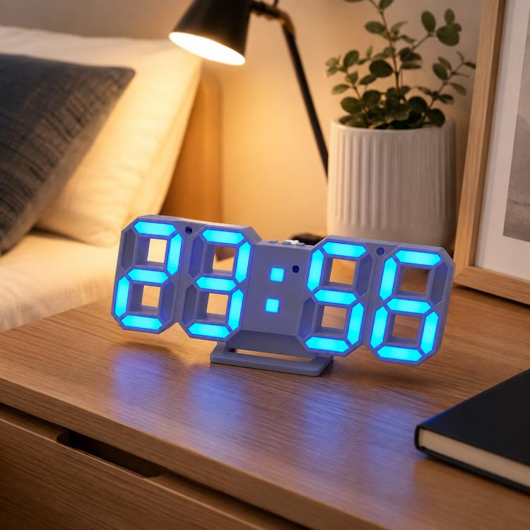 LED digital clock with blue 4-digit LED time display on a desk