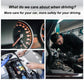 OBD2 code reader device held near a car engine compartment
