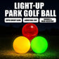 Three glow park golf balls: red, yellow, and green.