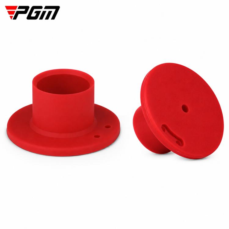Red rubber park golf tee with round base and ball-holding cup, side view