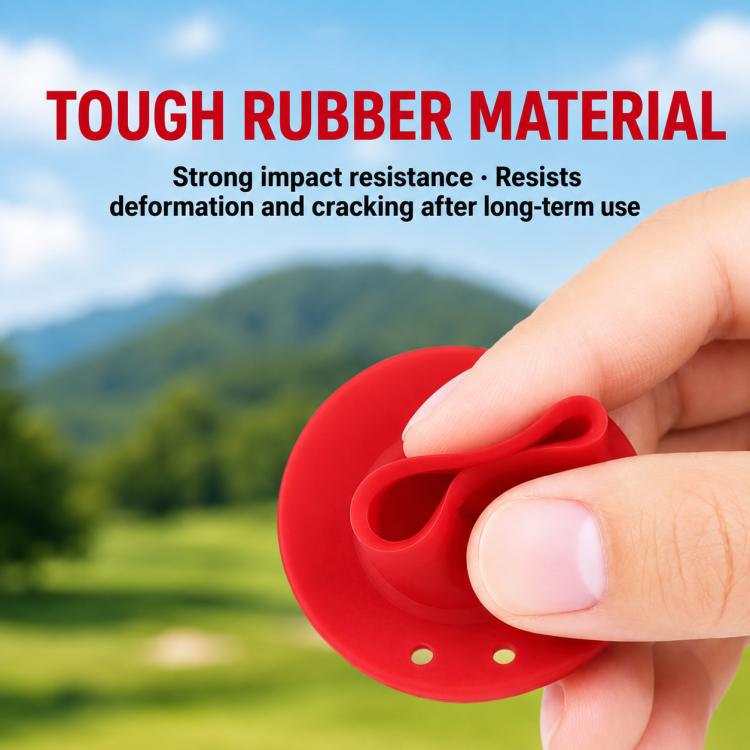 Red rubber park golf tee held in hand, showing round base and ball slot