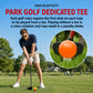 Orange rubber park golf tee in a grassy park setting, round base with ball cup