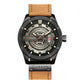 Men's leather analog watch with tan strap, black case, light gray dial, and date display