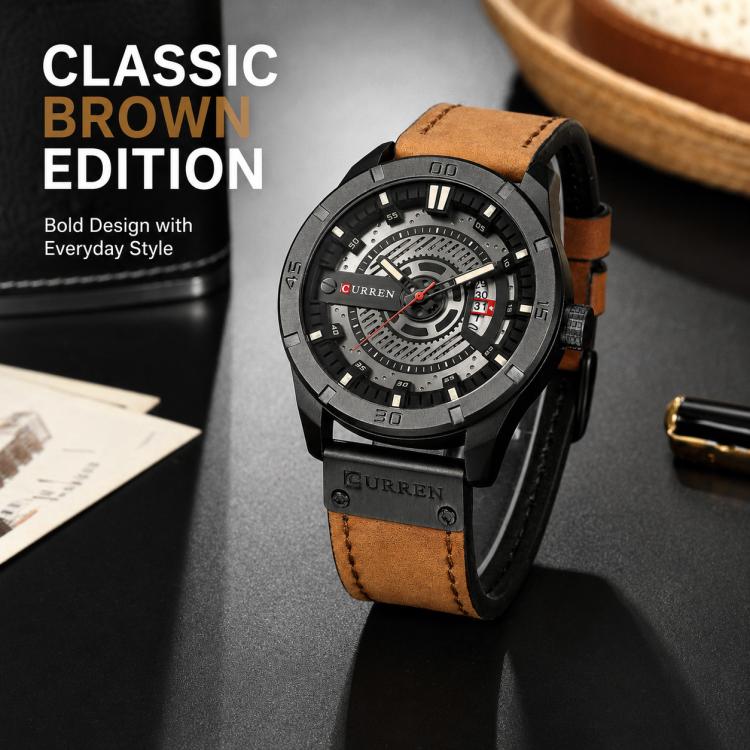 Men's leather analog watch with brown strap, black case, white dial accents, and date display