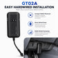 Black GPS vehicle tracker with power cable mounted near a vehicle dashboard area