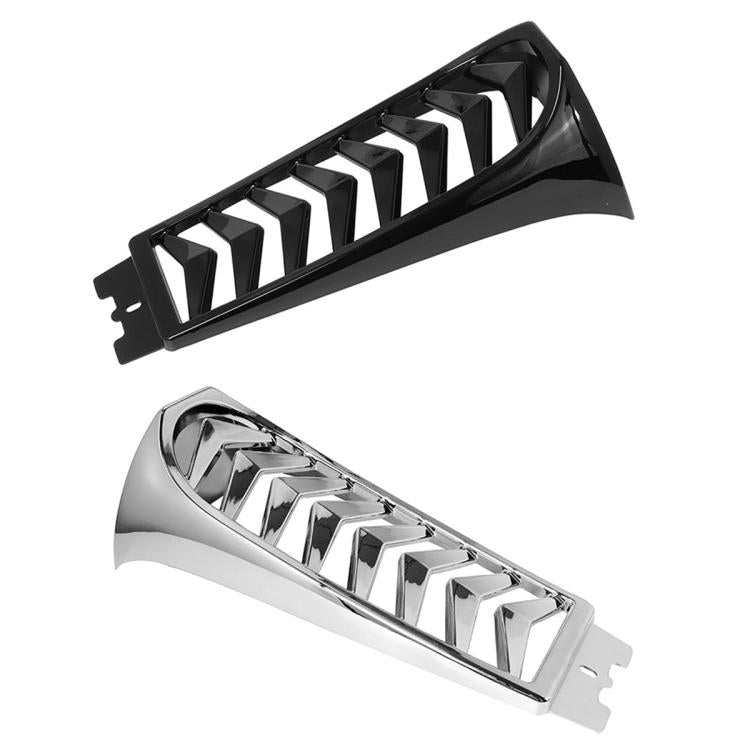 Black and silver? blade-style air deflector with stacked chevron fins, angled view