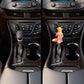 Car manual gear shift knob with pink bikini figure topper shown from two angles