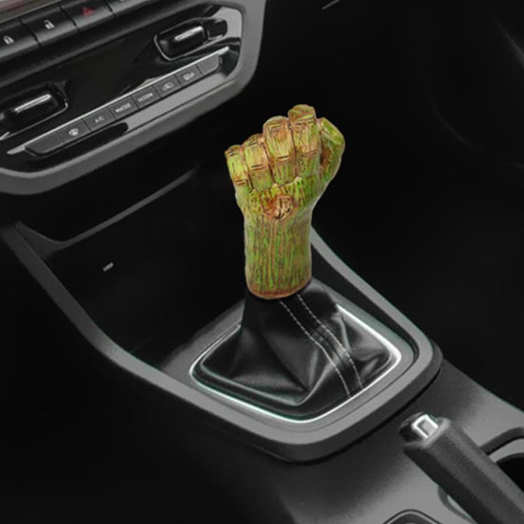 Palm-shaped manual gear shift knob with yellow-green resin finish and black stitched boot.