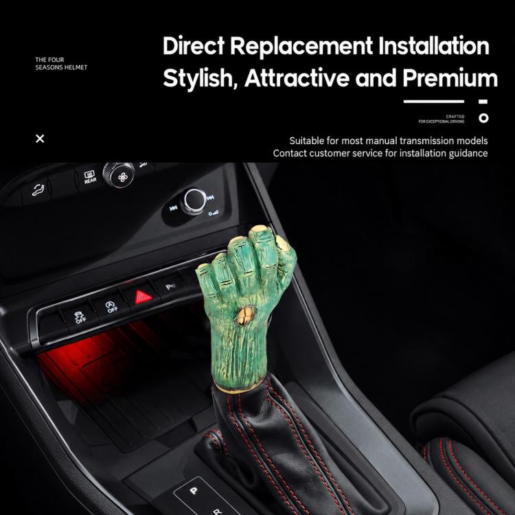 Palm-shaped manual gear shift knob with green resin finish installed in a car.