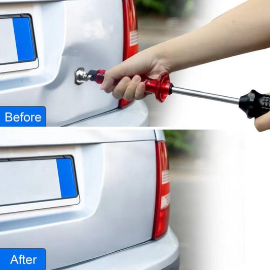 Hand using red dent puller tool on a vehicle rear panel near tail light