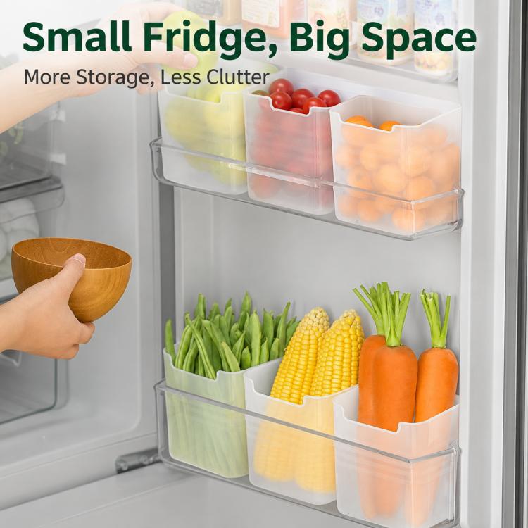 Set of clear refrigerator door storage bins holding vegetables and fruit, open tops.