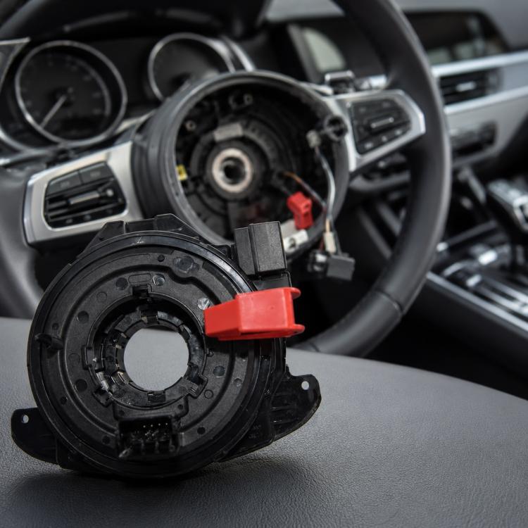 Steering wheel airbag clock spring spiral cable with red connector clip, front view