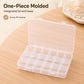 One-piece clear plastic organizer box with integrated lid and base, grid compartments