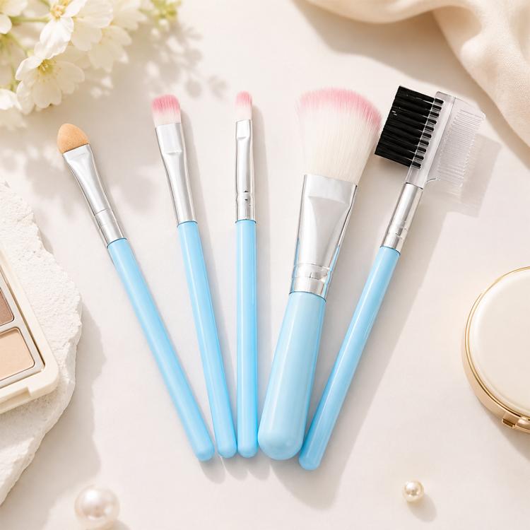 Blue makeup brush set with five brushes and soft bristles, silver ferrules