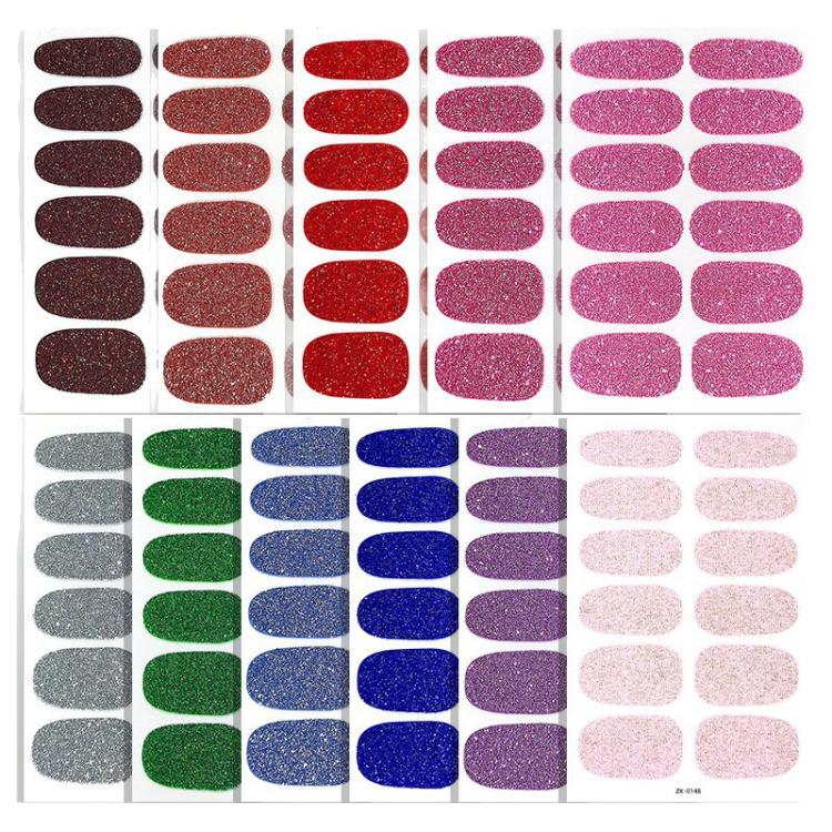 Glitter nail sticker sheets with oval decals in assorted colors: red, blue, green, pink.