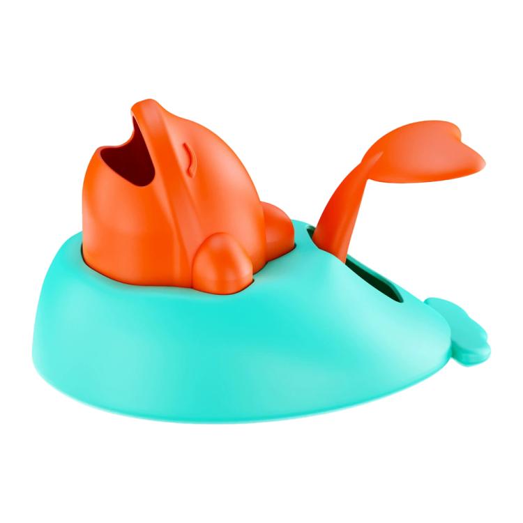 Whale-shaped treat-launch toy with orange top fins and teal launching dish