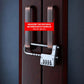 Combination lock with adjustable shackle fitted across two cabinet handles, secured on dark wood