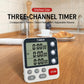 Three-channel countdown kitchen timer on stand with three LCD time displays and controls