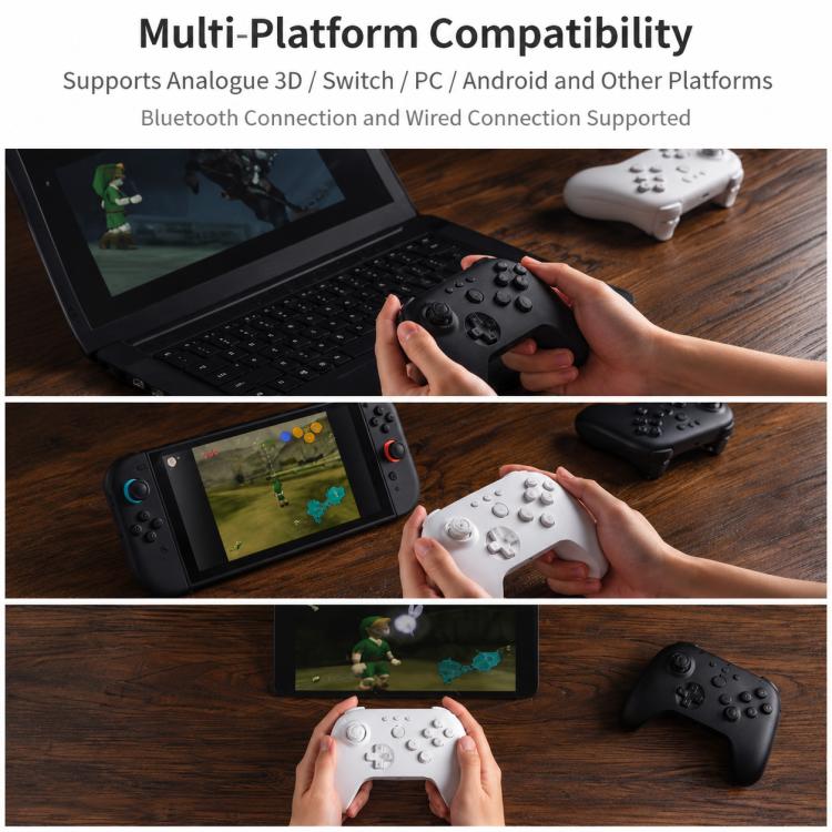 Black N64 Bluetooth game controller in hand with analog sticks and face buttons