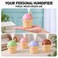Ice-cream shape personal humidifier with pink cone top on a hand