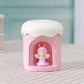 Pink mini night light humidifier with angel figurine in front window