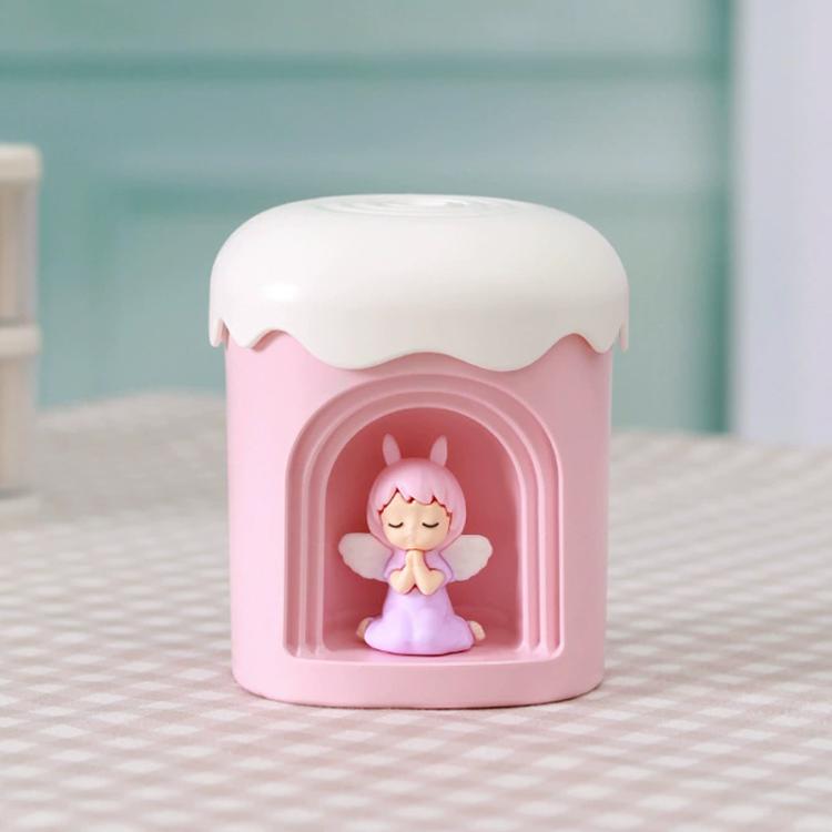Pink mini night light humidifier with angel figurine in front window